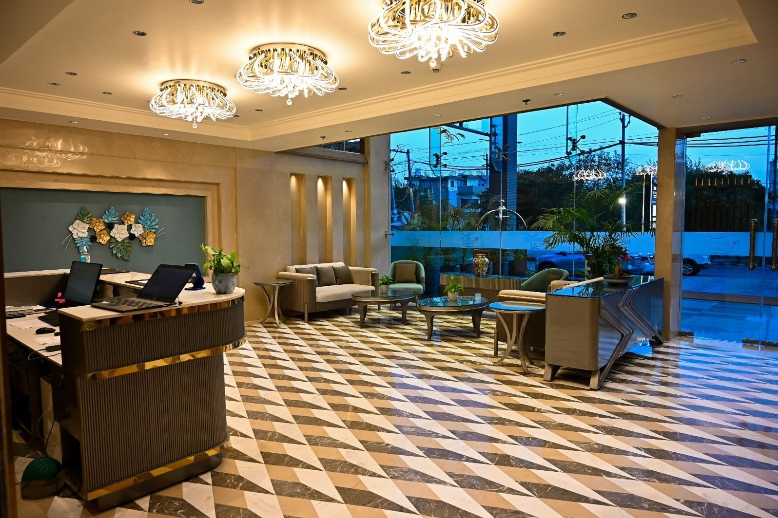 A spacious lobby featuring comfortable seating arrangements and a reception desk at 